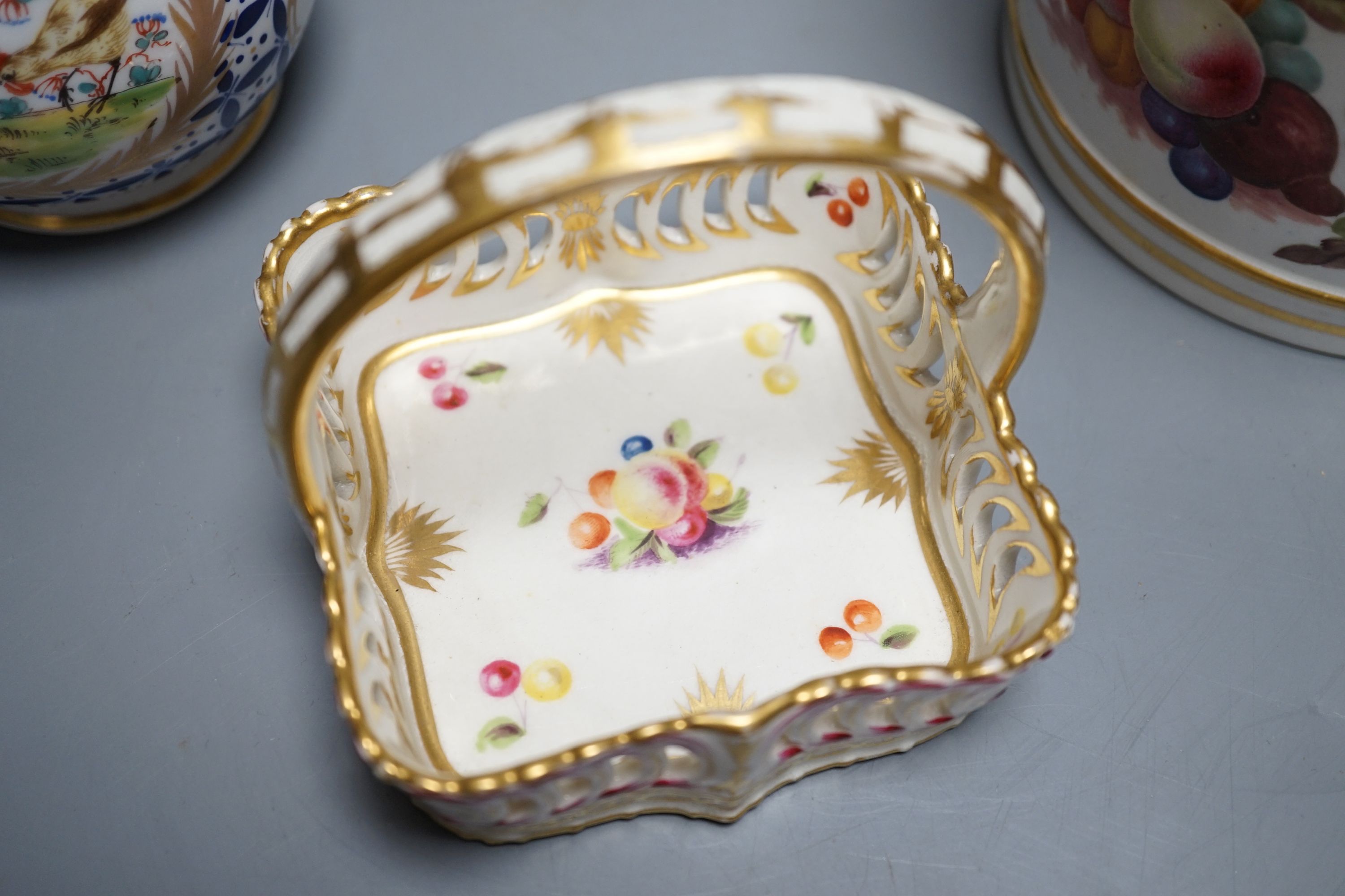 An early 19th century Derby porter mug, 13cm high, a Derby dish and a Chantilly-style sugar sifter